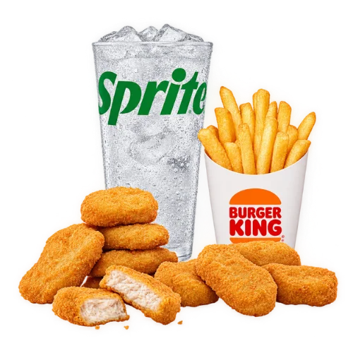 Chicken nuggets meal with crispy golden nuggets, fries, and a Sprite, one nugget split to show white meat